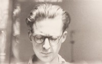 Self-Portrait with Reflection in Glass Window, undated, black-and-white photography, 5,2x8,4 cm, archive of the artist`s heirs